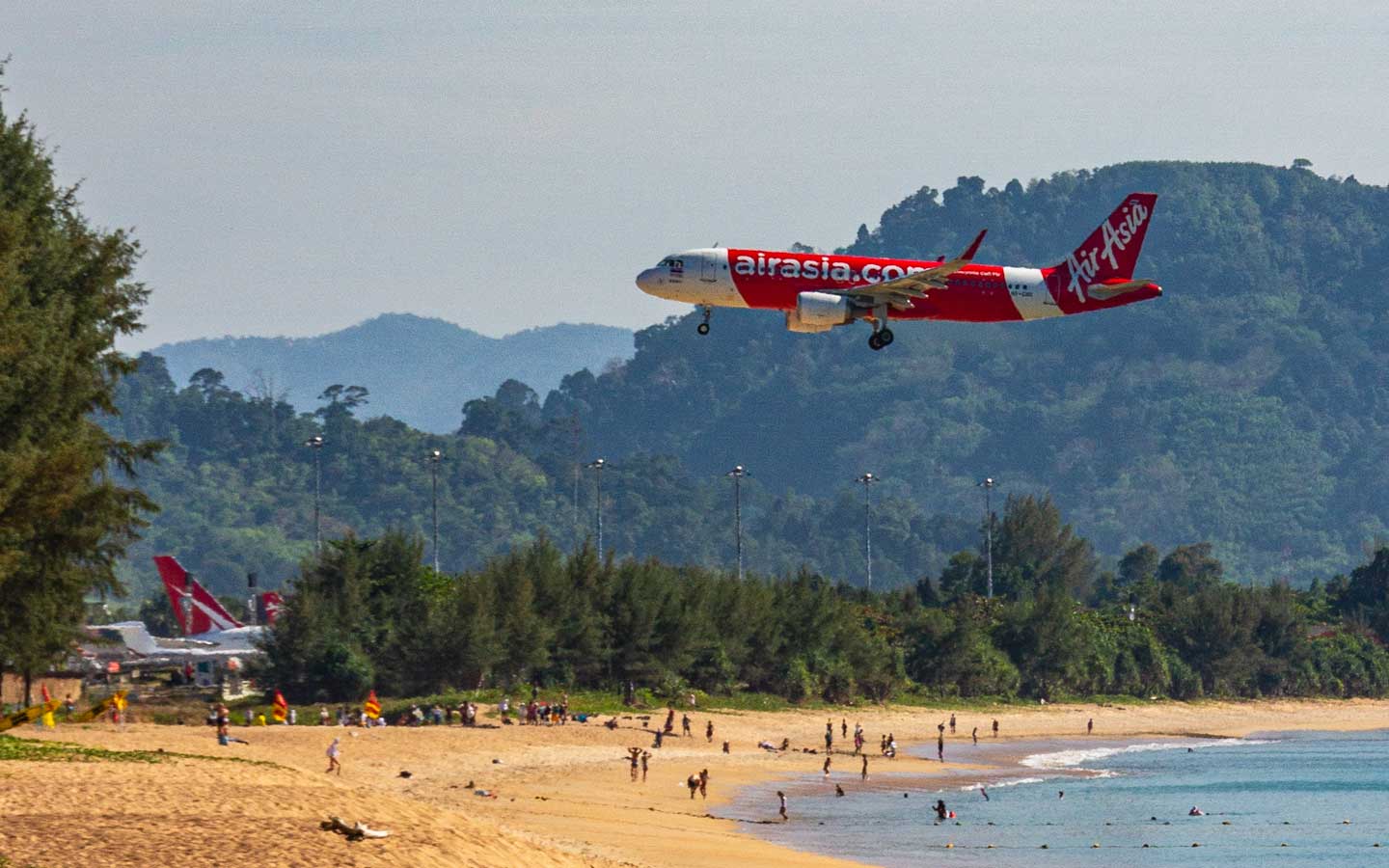 Airplane coming in low over Mai Khao Beach which is one of Phuket's best beaches