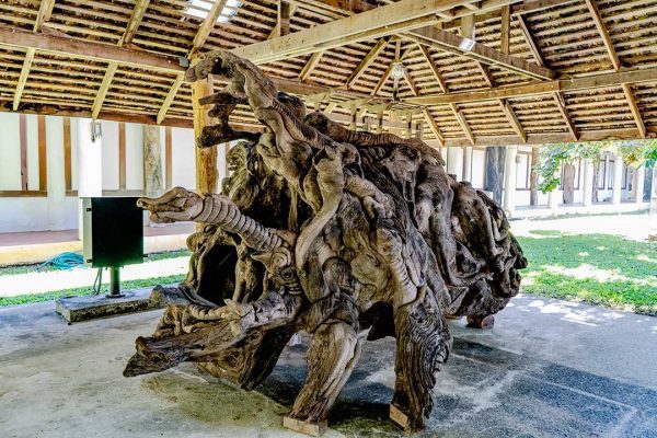 A giant Teak root that is very beautiful and imaginatively carved Rai Mae Fah Luang, Chiang Rai, Thailand